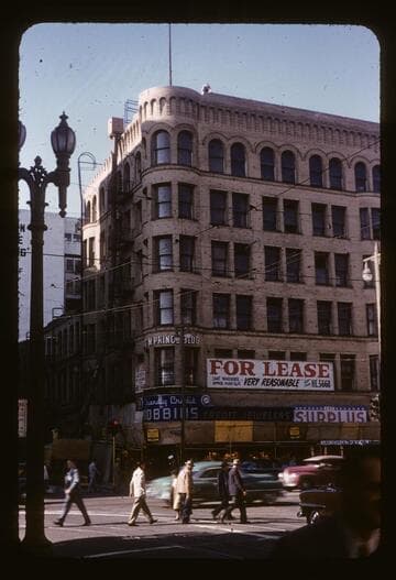 Old Frost Building, now Haig M. Prince Building, having its coping removed